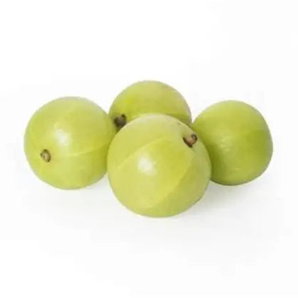 Four green fruits on a white background