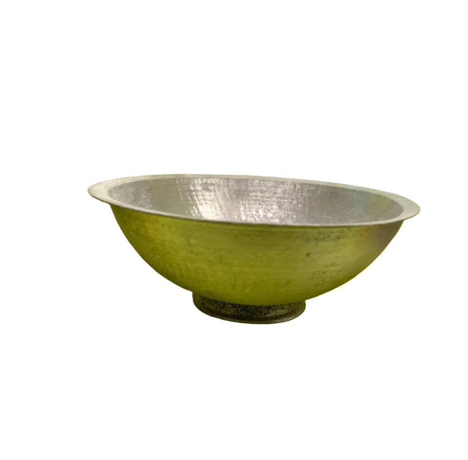 Silver bowl on a bright yellow background
