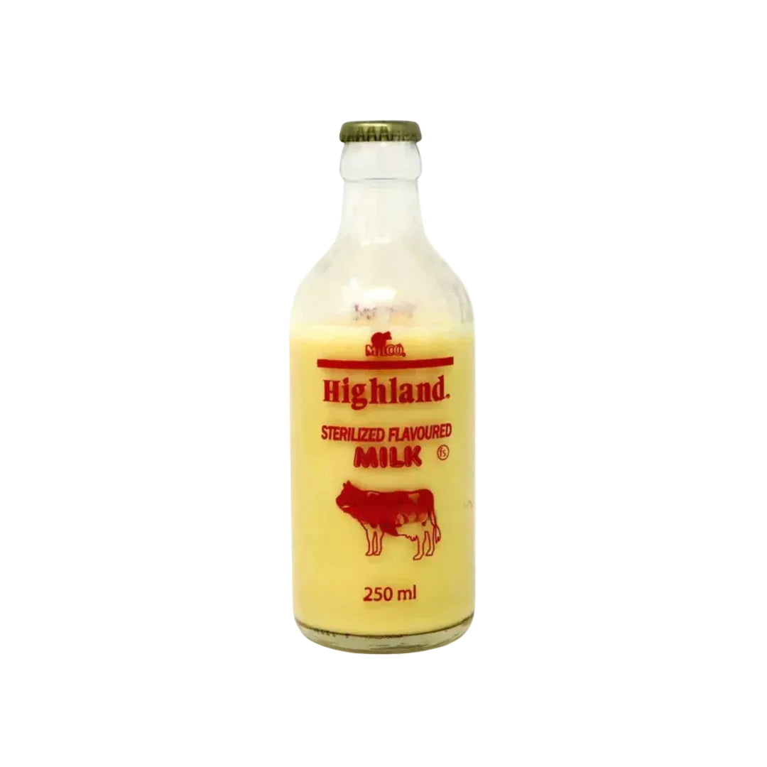 Bottle of Highland sterilized flavored milk with a cow illustration on a white background