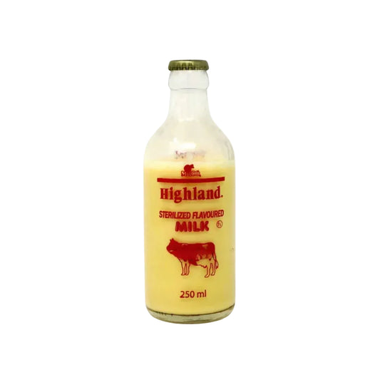 Bottle of Highland sterilized flavored milk with a cow illustration on a white background