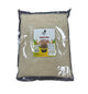 Packaged rice with a label on a dark surface
