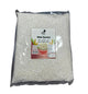 Packaged white raw rice with a label on a dark surface