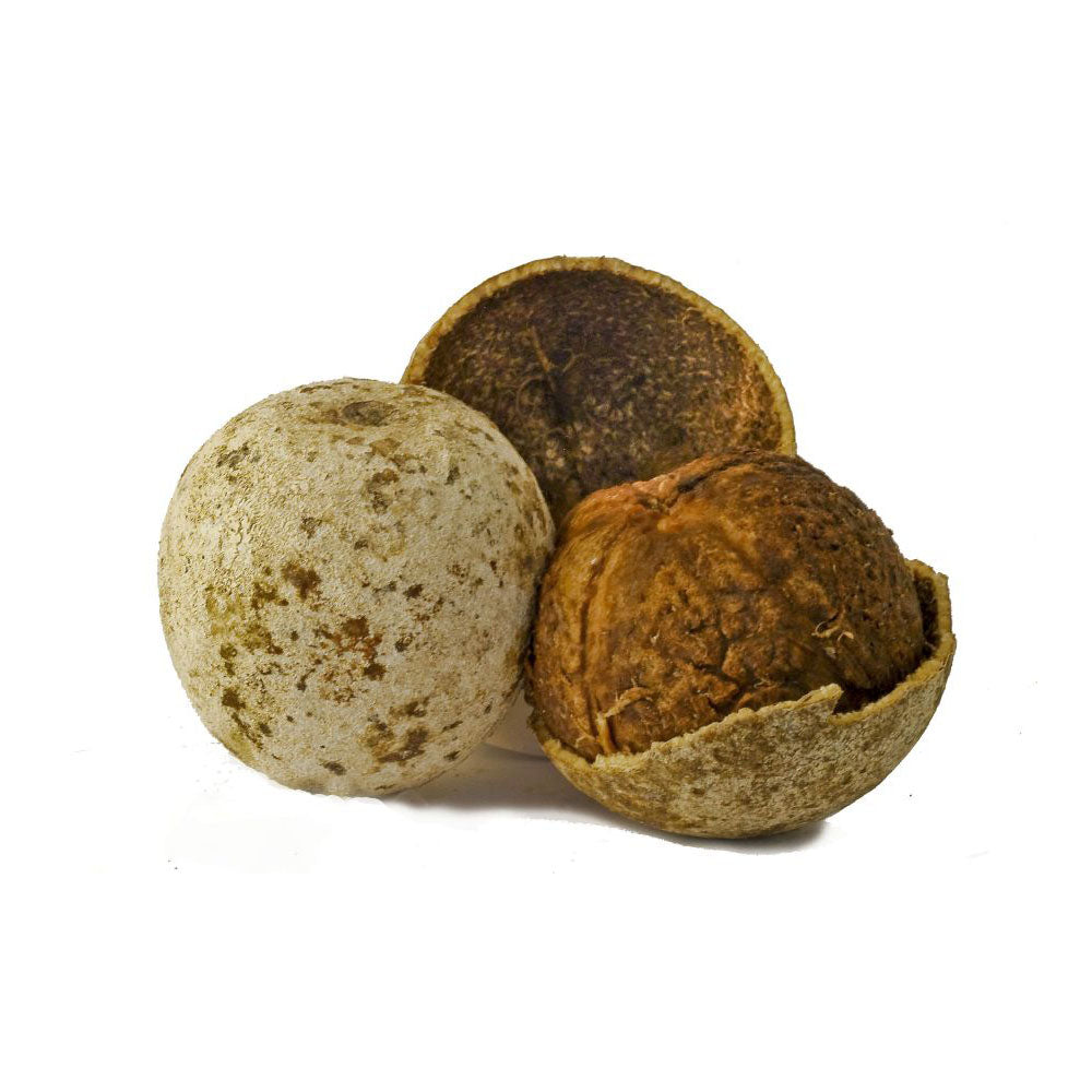 Three wooden balls with natural textures on a white background